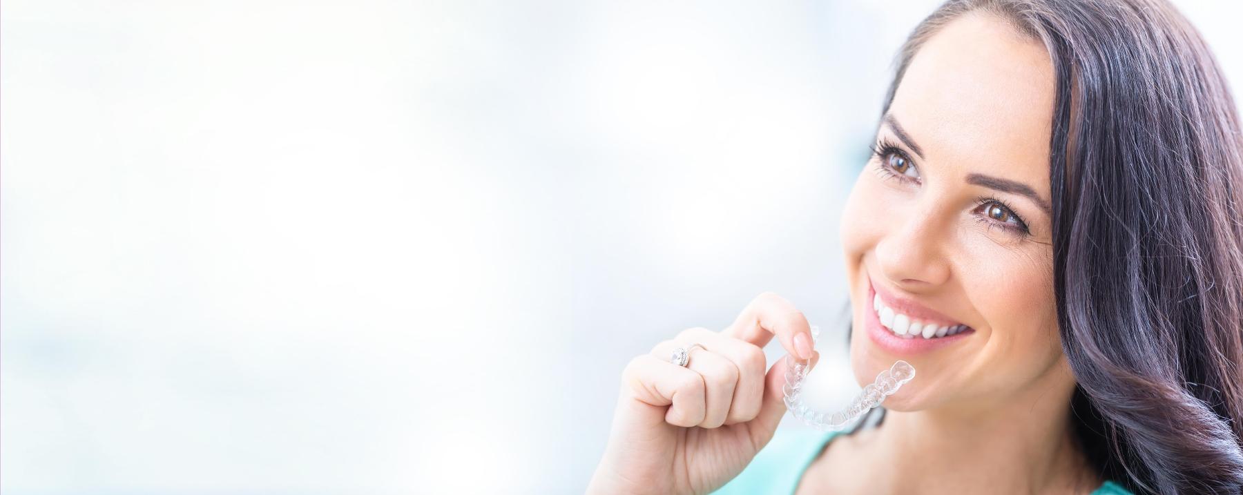 woman with Invisalign clear braces in west bradenton